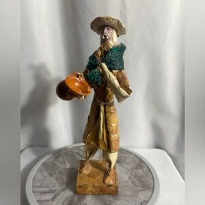 Handcrafted Artisan Figurine with Orange and Green Accents